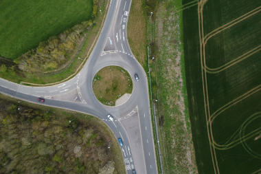 Drone shot of cars on a 3 way roundabout in Leicestershire, uk.